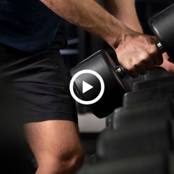 Lifting a dumbbell in a gym